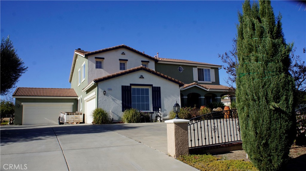 18689 Hawkhill Avenue Perris, CA 92570 - Photo 2 of 52 a front view of a house with garden