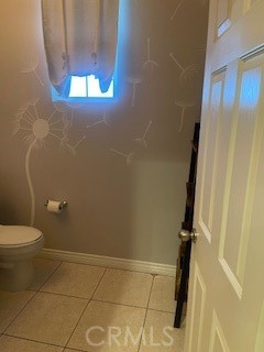 18689 Hawkhill Avenue Perris, CA 92570 - Photo 23 of 52 a bathroom with a granite countertop shower and a toilet