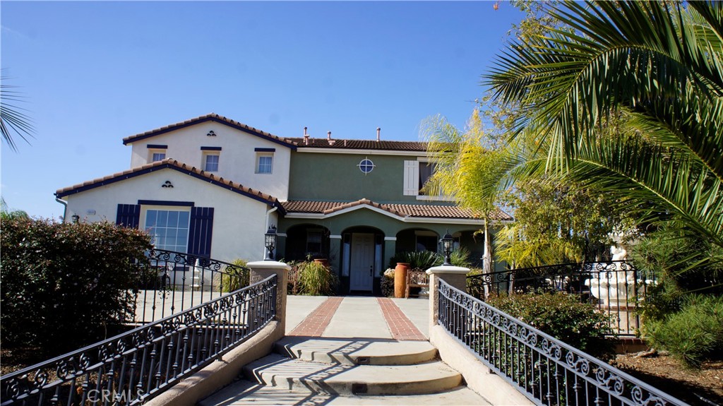 18689 Hawkhill Avenue Perris, CA 92570 - Photo 3 of 52 a front view of house with yard patio and furniture