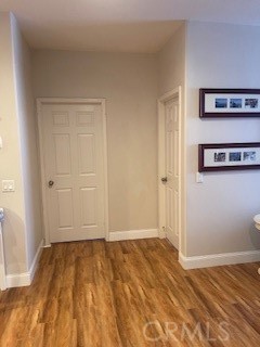 18689 Hawkhill Avenue Perris, CA 92570 - Photo 32 of 52 a view of a room with wooden floor and wall painting