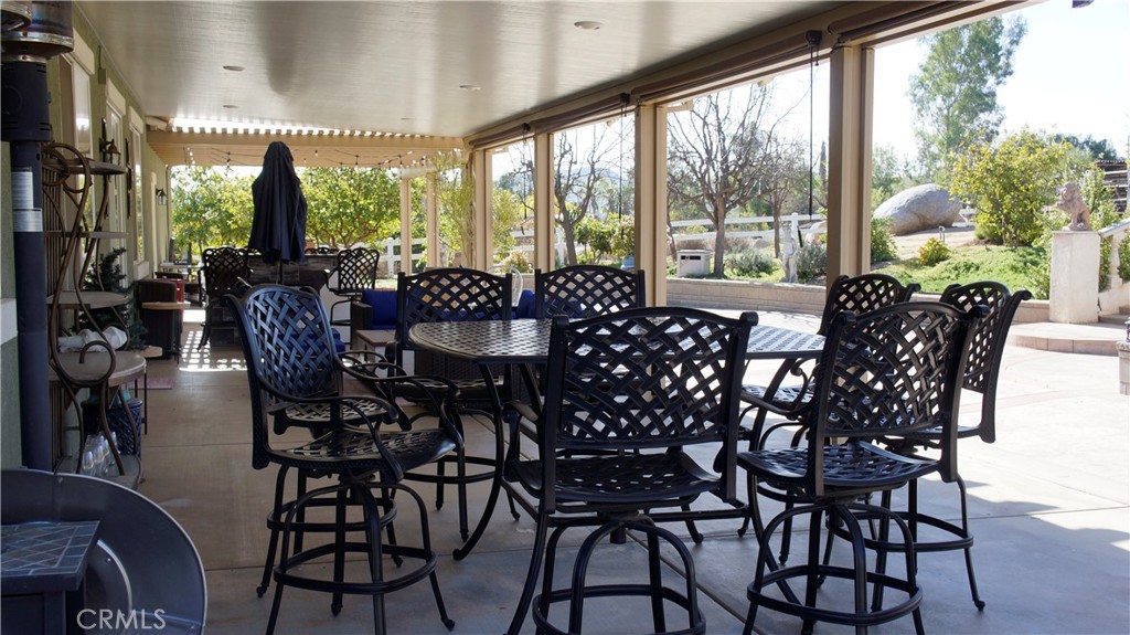 18689 Hawkhill Avenue Perris, CA 92570 - Photo 50 of 52 a view of a dining room with furniture window and outside view