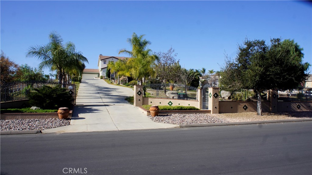 18689 Hawkhill Avenue Perris, CA 92570 - Photo 52 of 52 a view of a street with palm trees