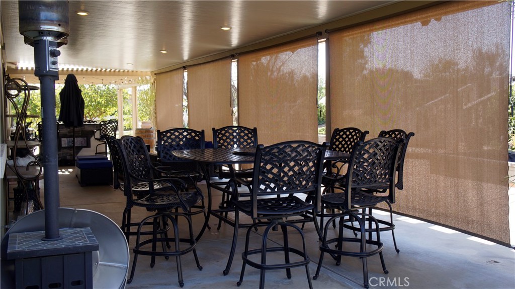 18689 Hawkhill Avenue Perris, CA 92570 - Photo 6 of 52 a view of a dining room with furniture window and outside view