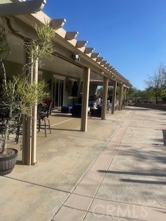 18689 Hawkhill Avenue Perris, CA 92570 - Photo 7 of 52 a view of a building with sitting area