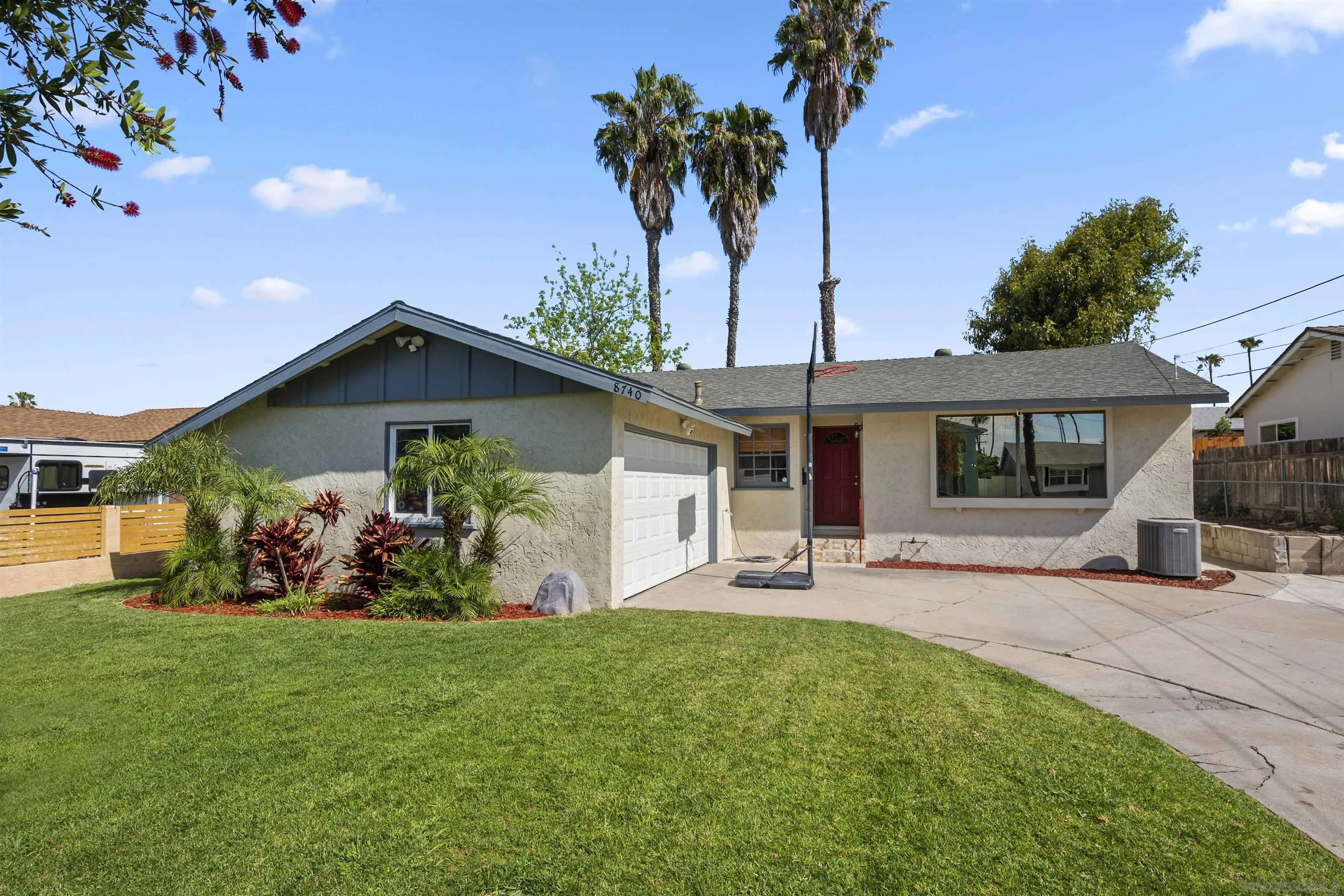 8740 Adriana Street Spring Valley, CA 91977 - Photo 1 of 32 a front view of a house with garden