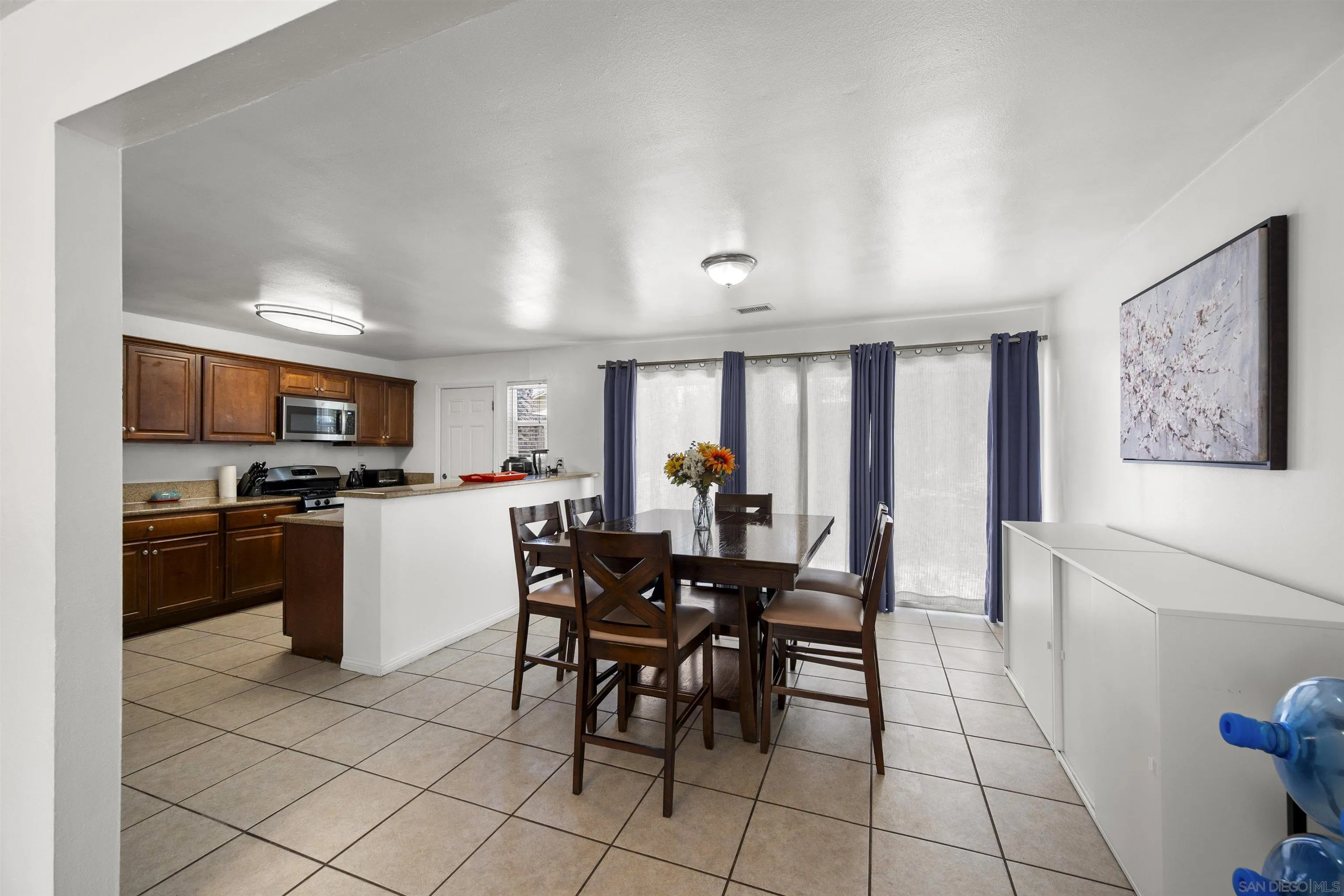 8740 Adriana Street Spring Valley, CA 91977 - Photo 14 of 32 a view of a dining room kitchen and a window