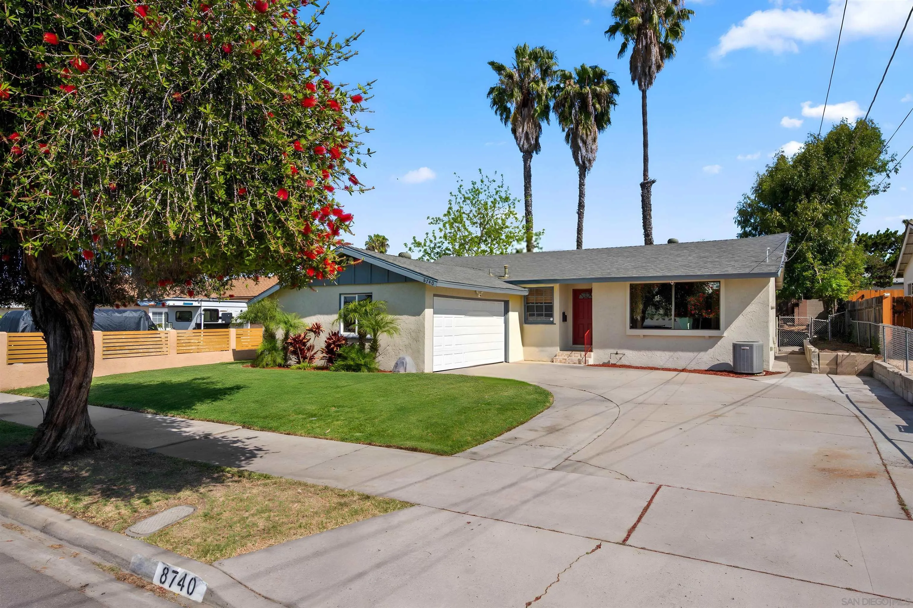 8740 Adriana Street Spring Valley, CA 91977 - Photo 2 of 32 a front view of a house with garden