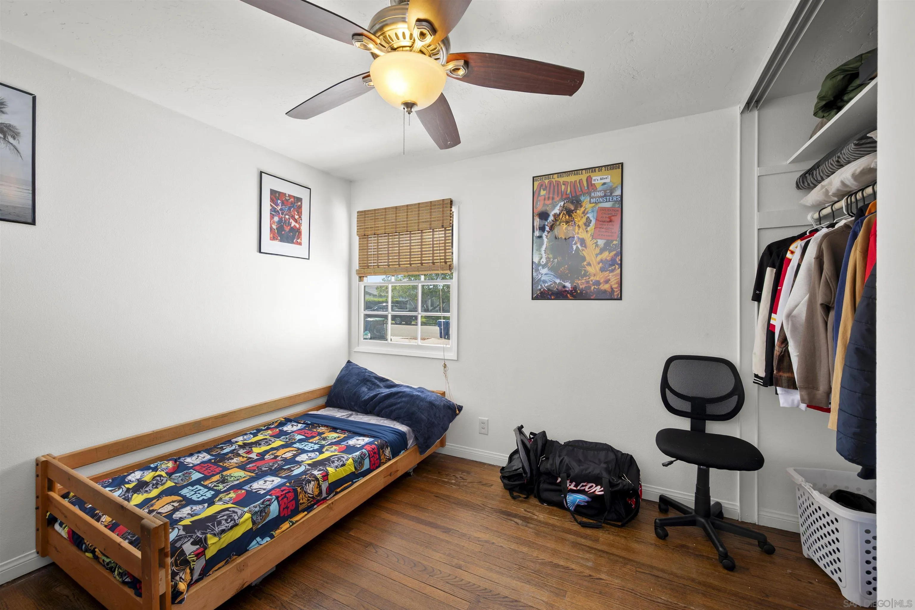 8740 Adriana Street Spring Valley, CA 91977 - Photo 21 of 32 a bedroom with furniture and a window