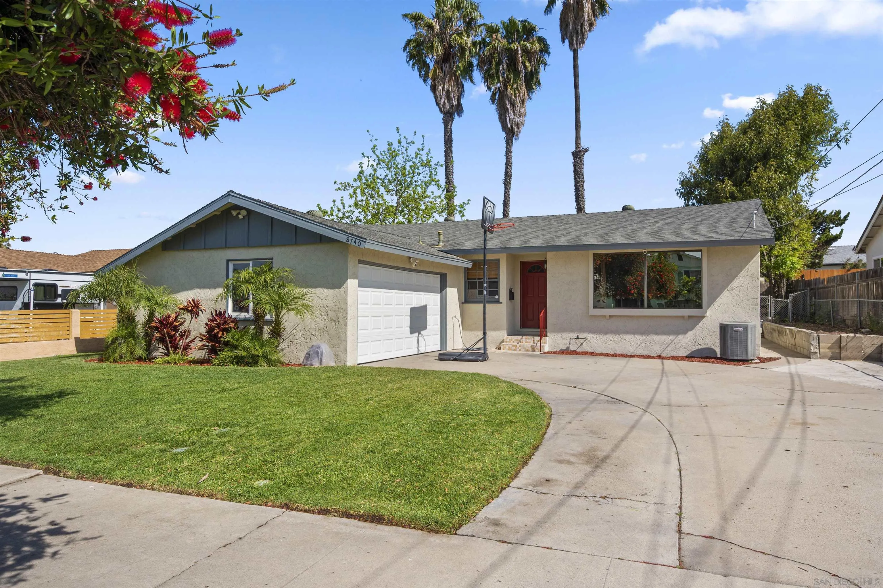 8740 Adriana Street Spring Valley, CA 91977 - Photo 30 of 32 a front view of a house with garden