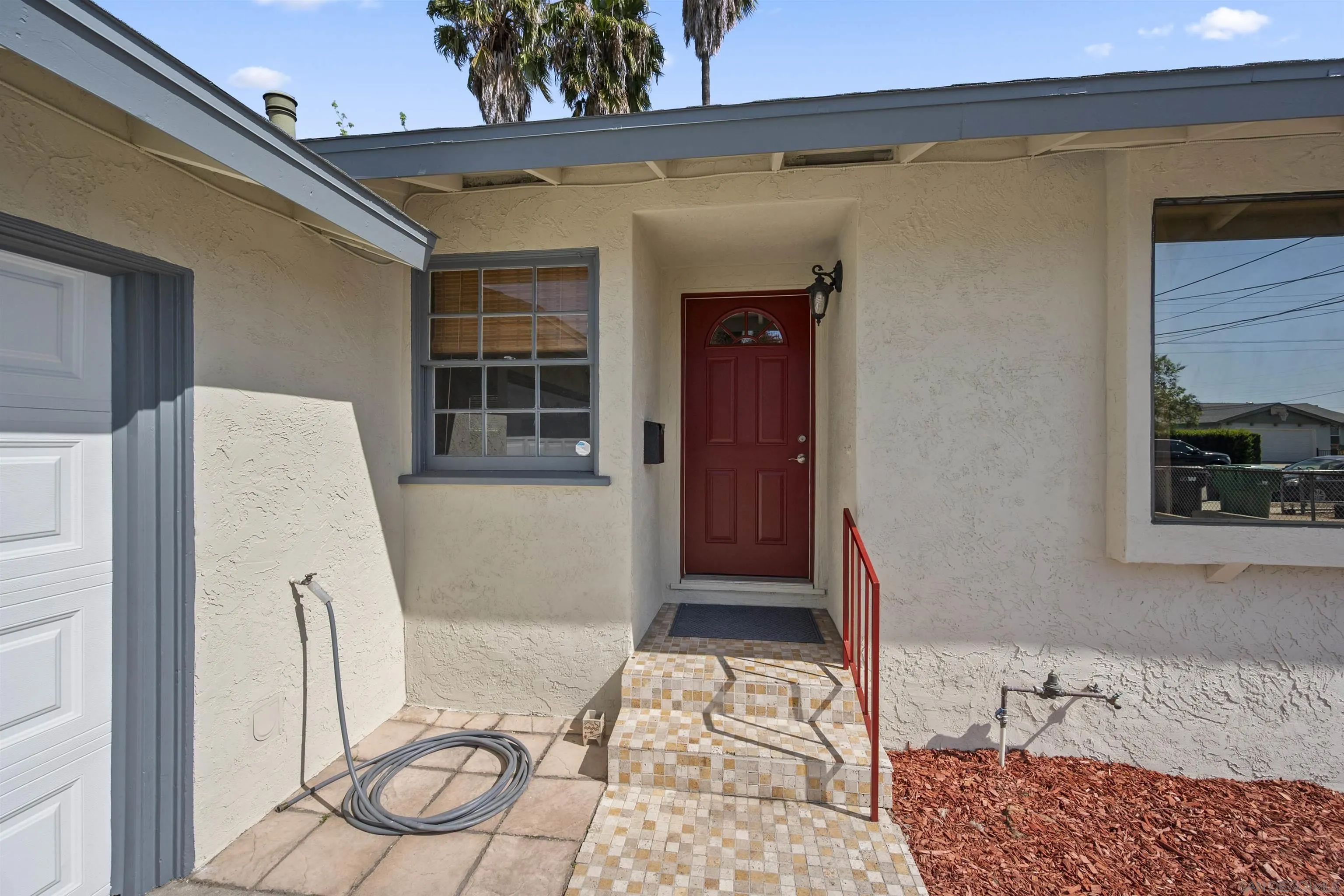 8740 Adriana Street Spring Valley, CA 91977 - Photo 3 of 32 a bedroom with furniture and a window