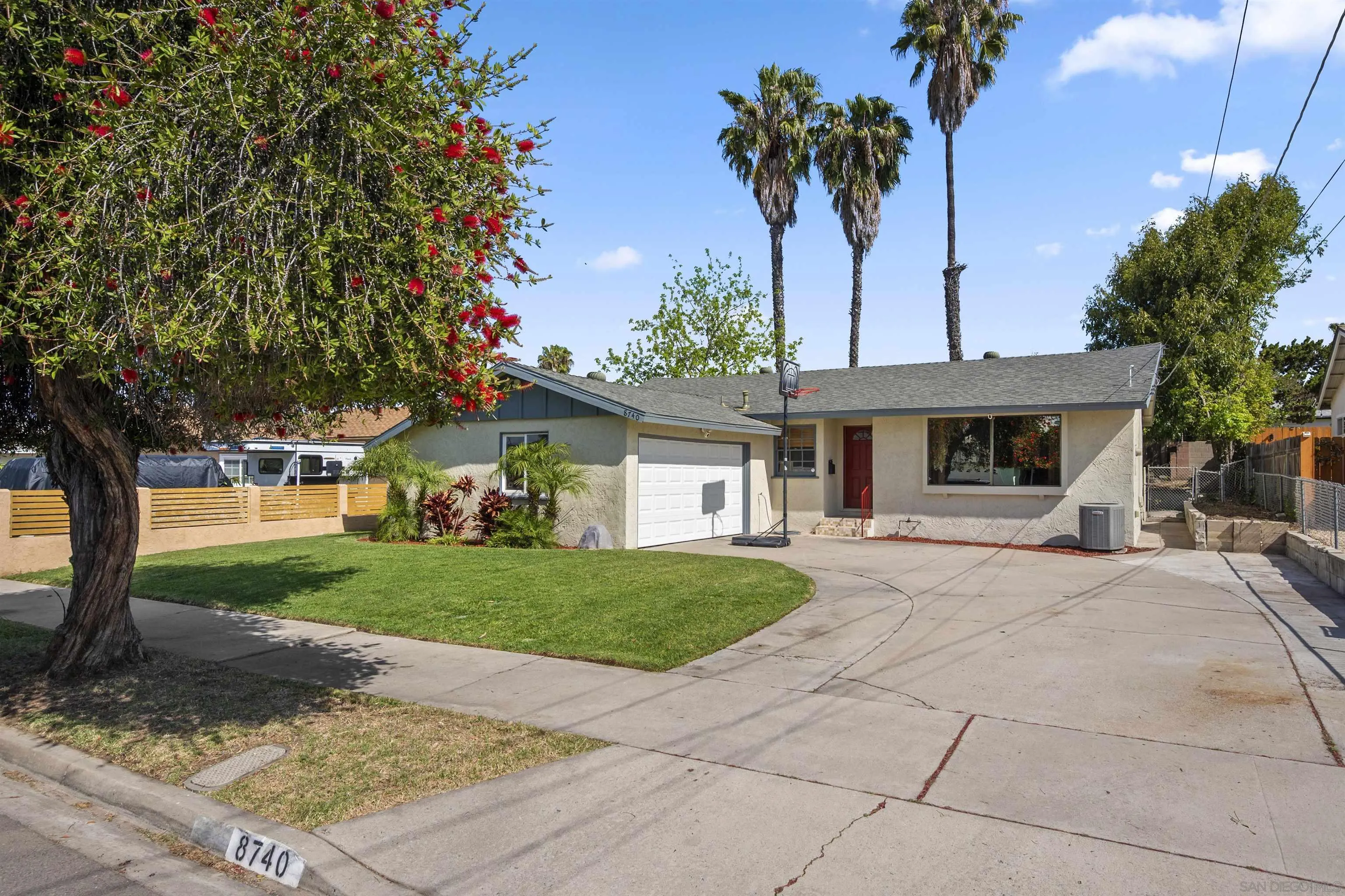 8740 Adriana Street Spring Valley, CA 91977 - Photo 31 of 32 a front view of a house with garden