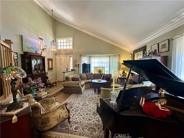 a living room with furniture chess board and a fireplace