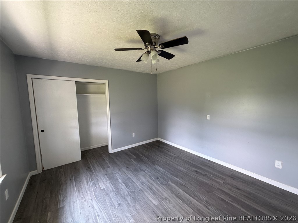 736 Tobermory Road Fayetteville, NC 28306 - Photo 13 of 17 wooden floor in an empty room with a window