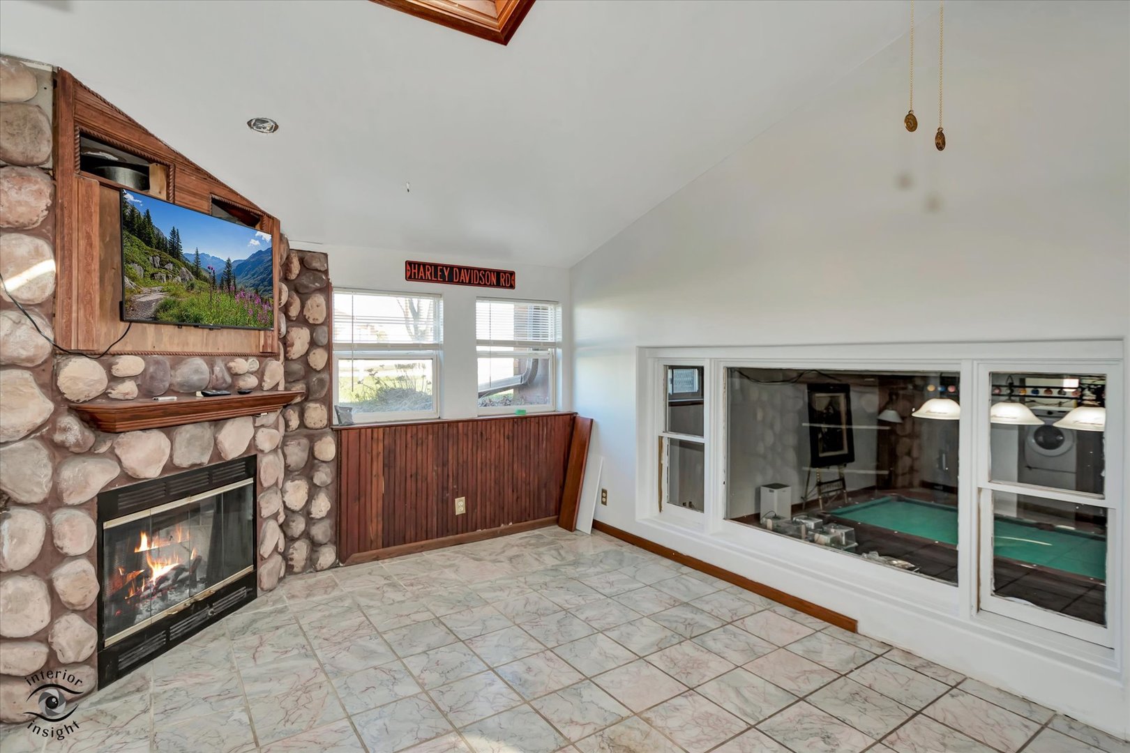 3230 North Glenn Road Bourbonnais, IL 60914 - Photo 13 of 34 a living room with furniture a flat screen tv and a fireplace