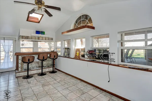 a kitchen with stainless steel appliances granite countertop a sink and a refrigerator