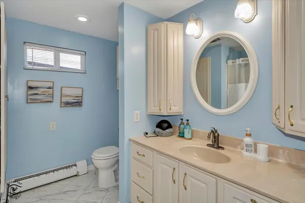 a bathroom with 2 sink and a mirror