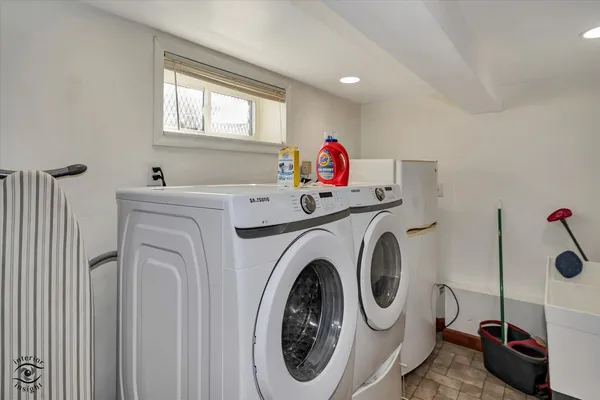 a utility room with dryer and washer