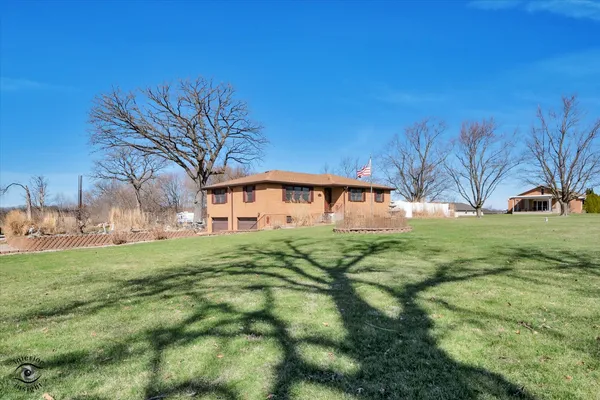 a view of a house with a big yard