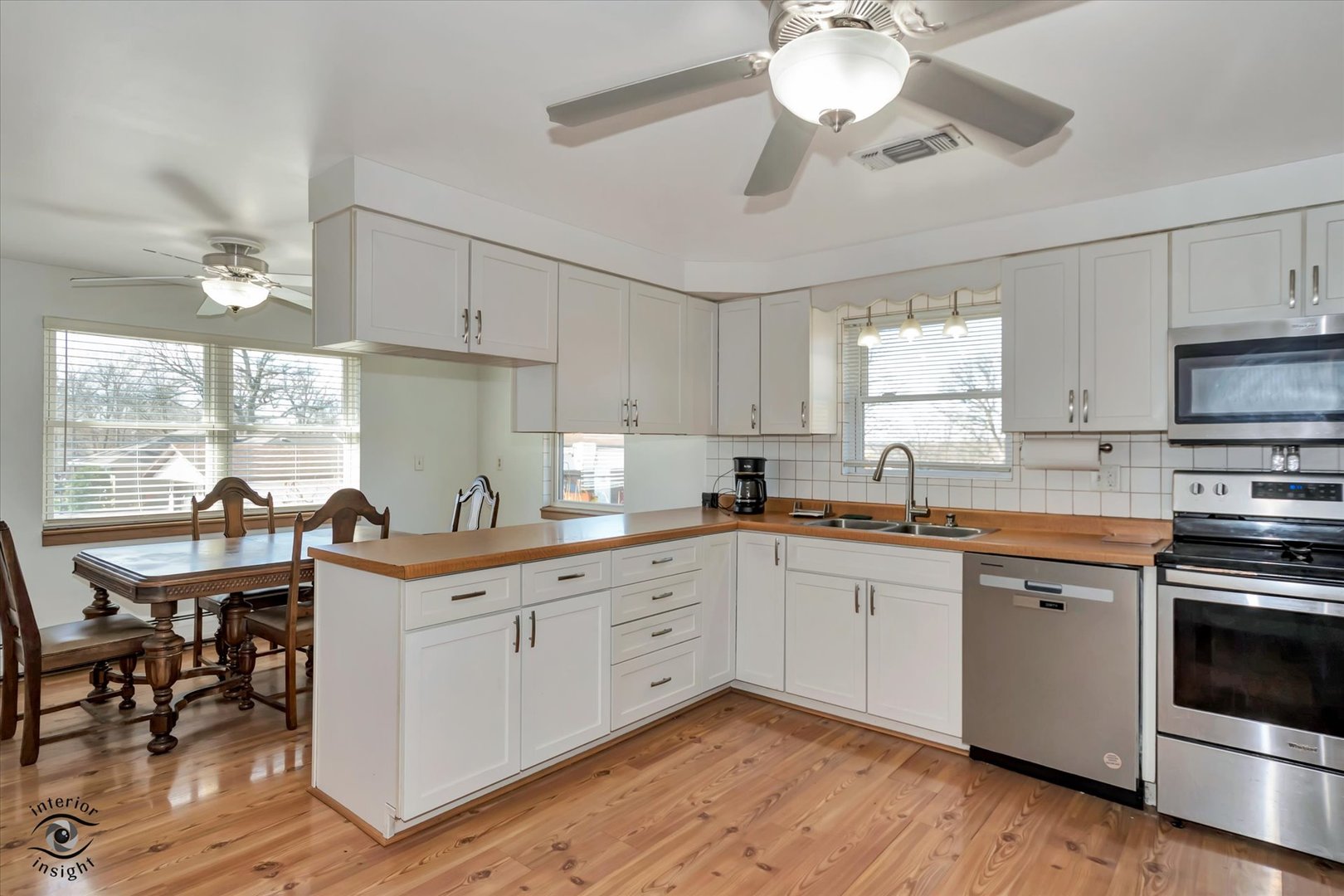3230 North Glenn Road Bourbonnais, IL 60914 - Photo 9 of 34 a kitchen with a sink cabinets and window