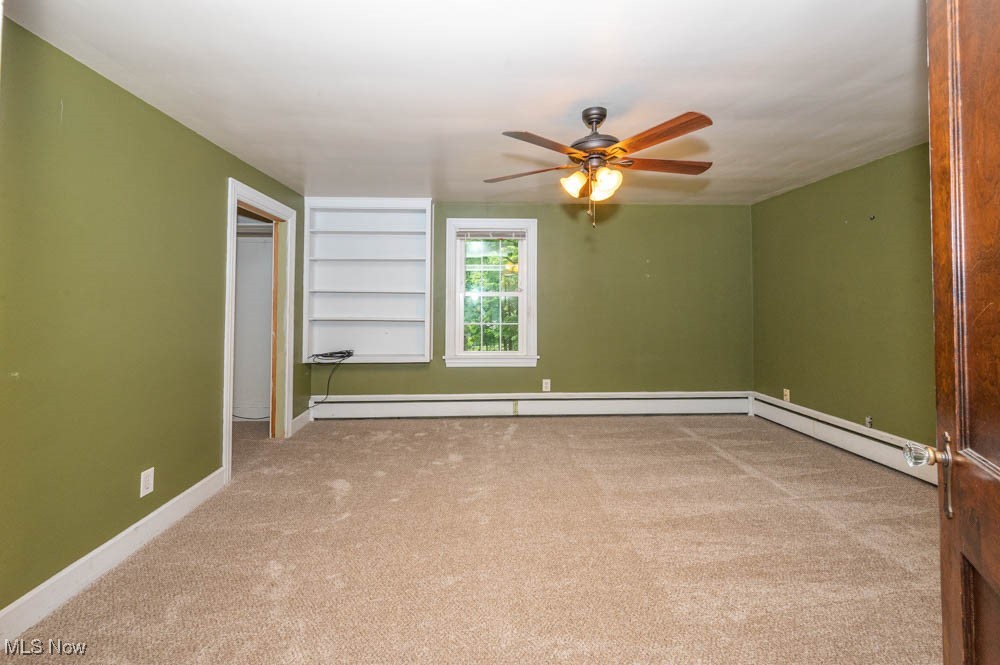 272 Ewing Road Youngstown, OH 44512 - Photo 14 of 19 Second bedroom with new carpeting (august 2025) and built in shelves