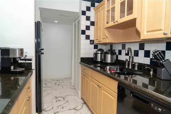 a kitchen with stainless steel appliances granite countertop a stove and a sink