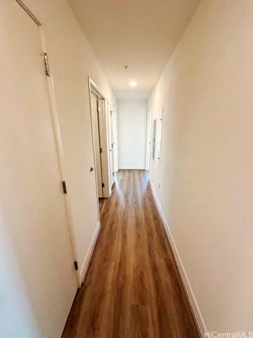 a bathroom with a sink a toilet a mirror and shower