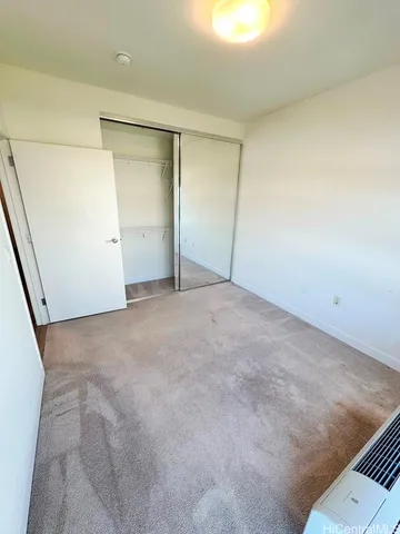 a view of an empty room with a fireplace