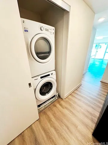 a view of a kitchen center island wooden floor and electronic appliances