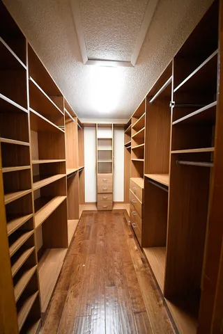 a bathroom with a double vanity sink toilet and shower