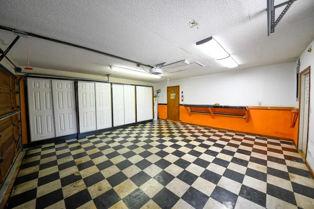 a bathroom with a black and white checkered floor
