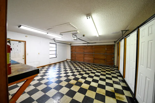 a view of a park with iron fence