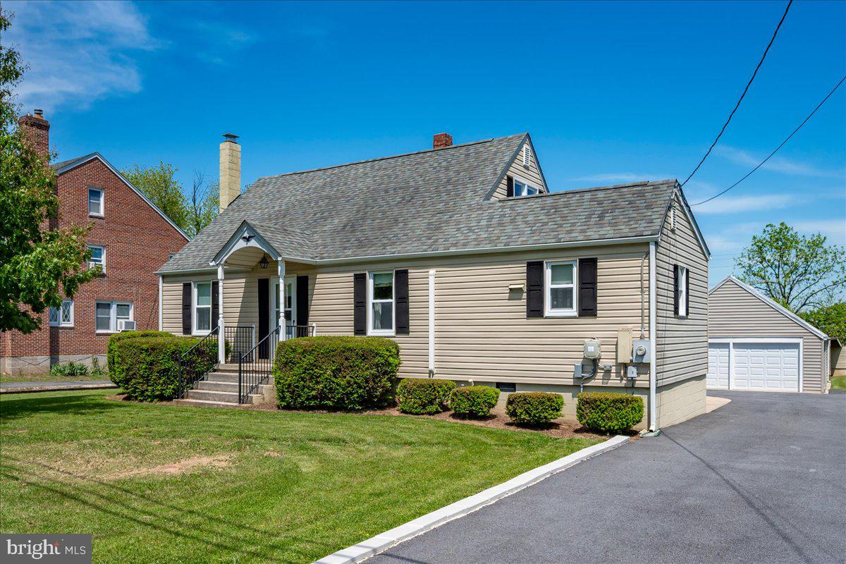 11205 Hessong Bridge Road Thurmont, MD 21788 - Photo 1 of 69 a front view of a house with a garden