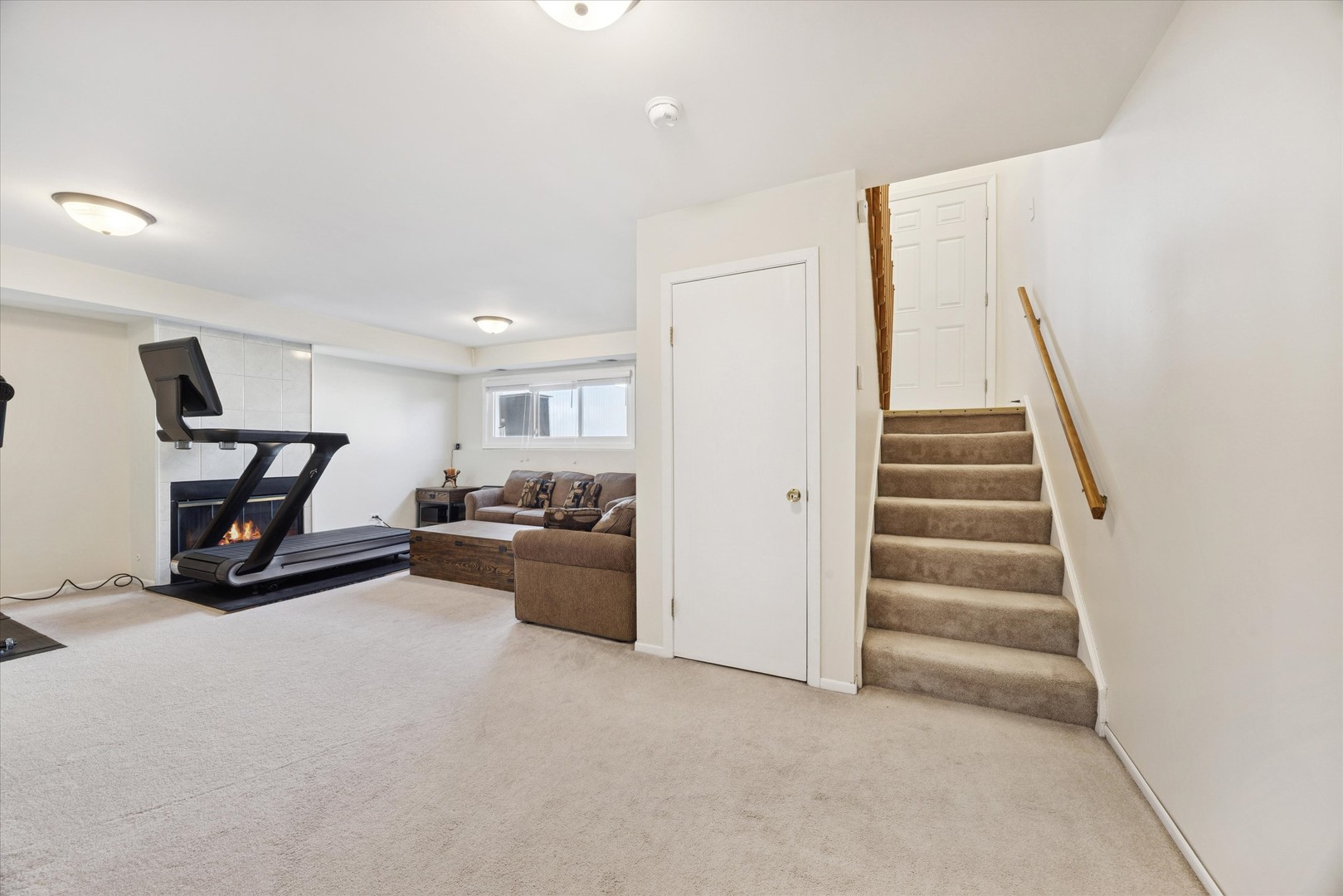 351 Park Ridge Lane, Unit D Aurora, IL 60504 - Photo 12 of 29 a view of a livingroom with furniture and stairs
