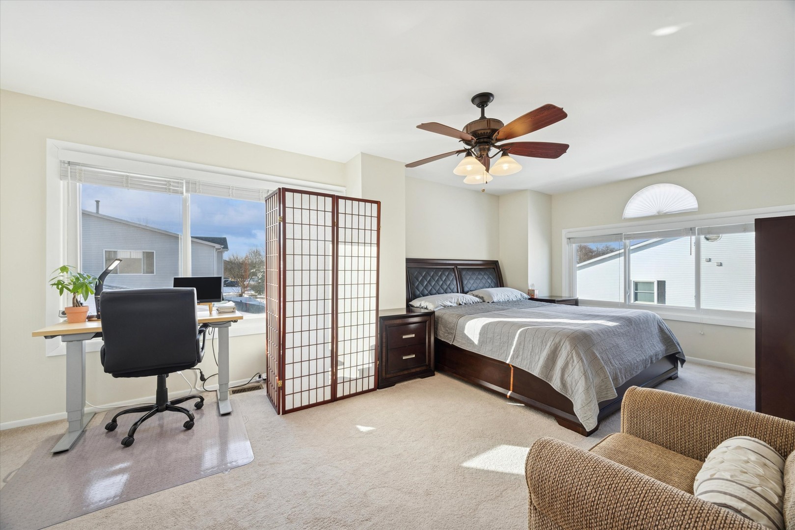 351 Park Ridge Lane, Unit D Aurora, IL 60504 - Photo 13 of 29 a bedroom with a bed and a chandelier