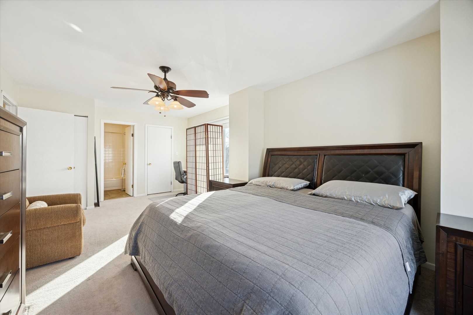 351 Park Ridge Lane, Unit D Aurora, IL 60504 - Photo 14 of 29 a bedroom with a bed and a chandelier