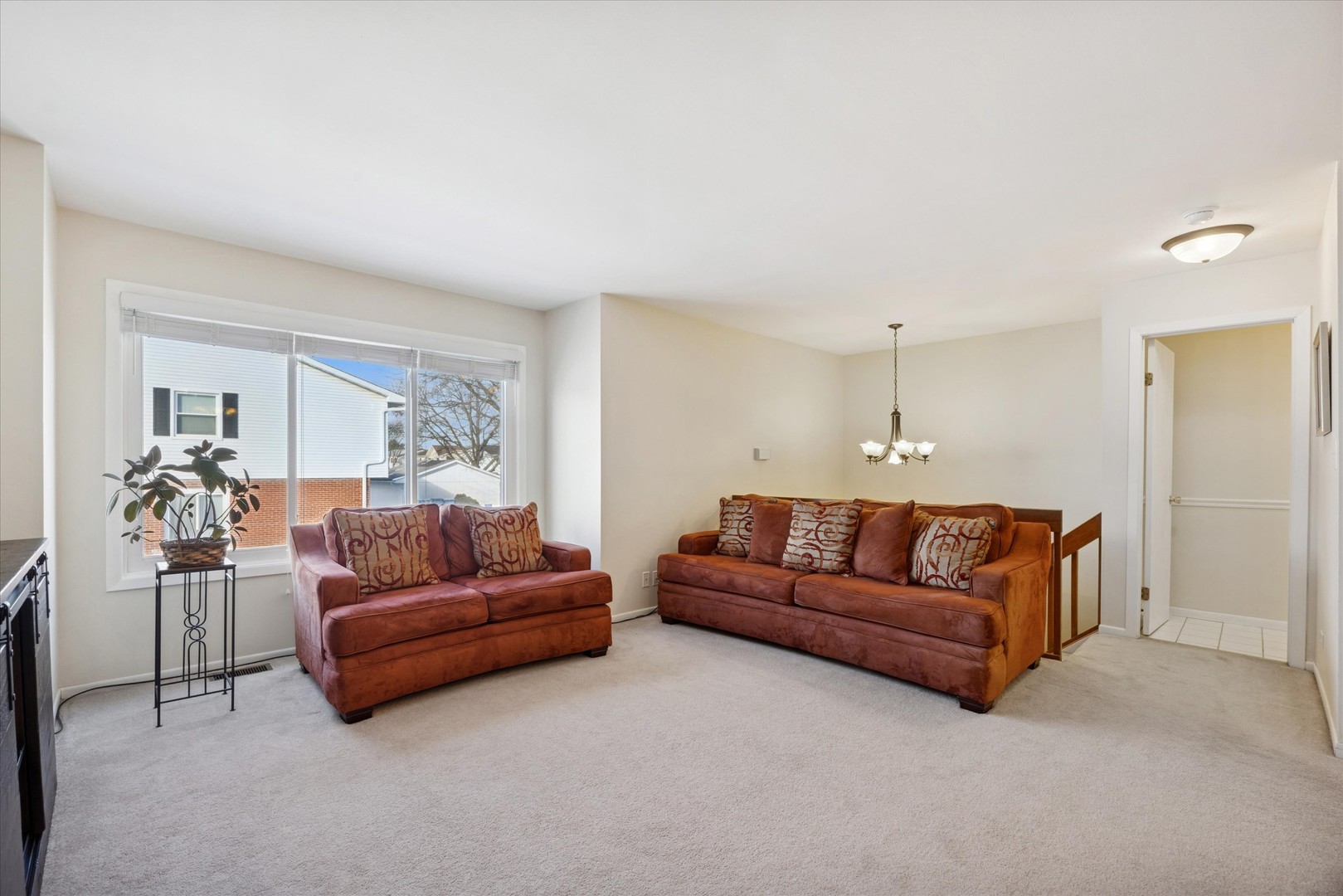 351 Park Ridge Lane, Unit D Aurora, IL 60504 - Photo 8 of 29 a living room with furniture and a couch
