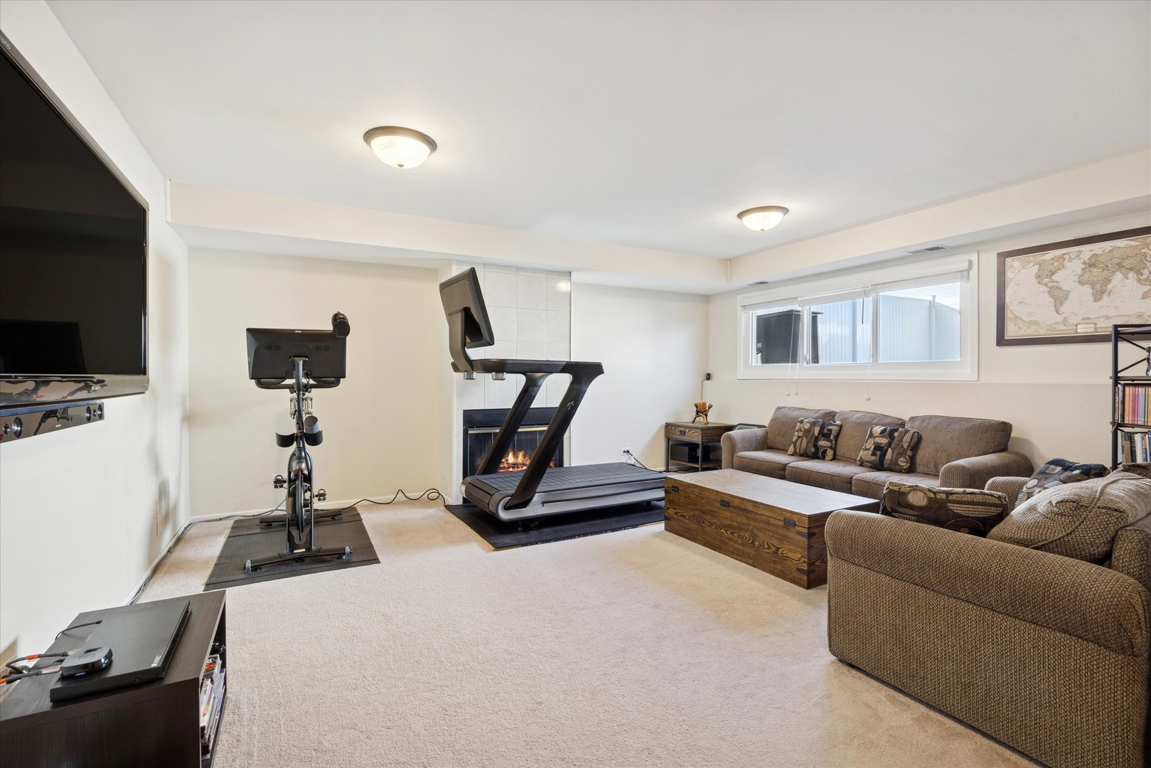 351 Park Ridge Lane, Unit D Aurora, IL 60504 - Photo 10 of 29 a living room with furniture and a flat screen tv