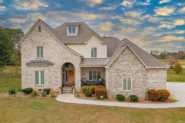 a front view of a house with a yard