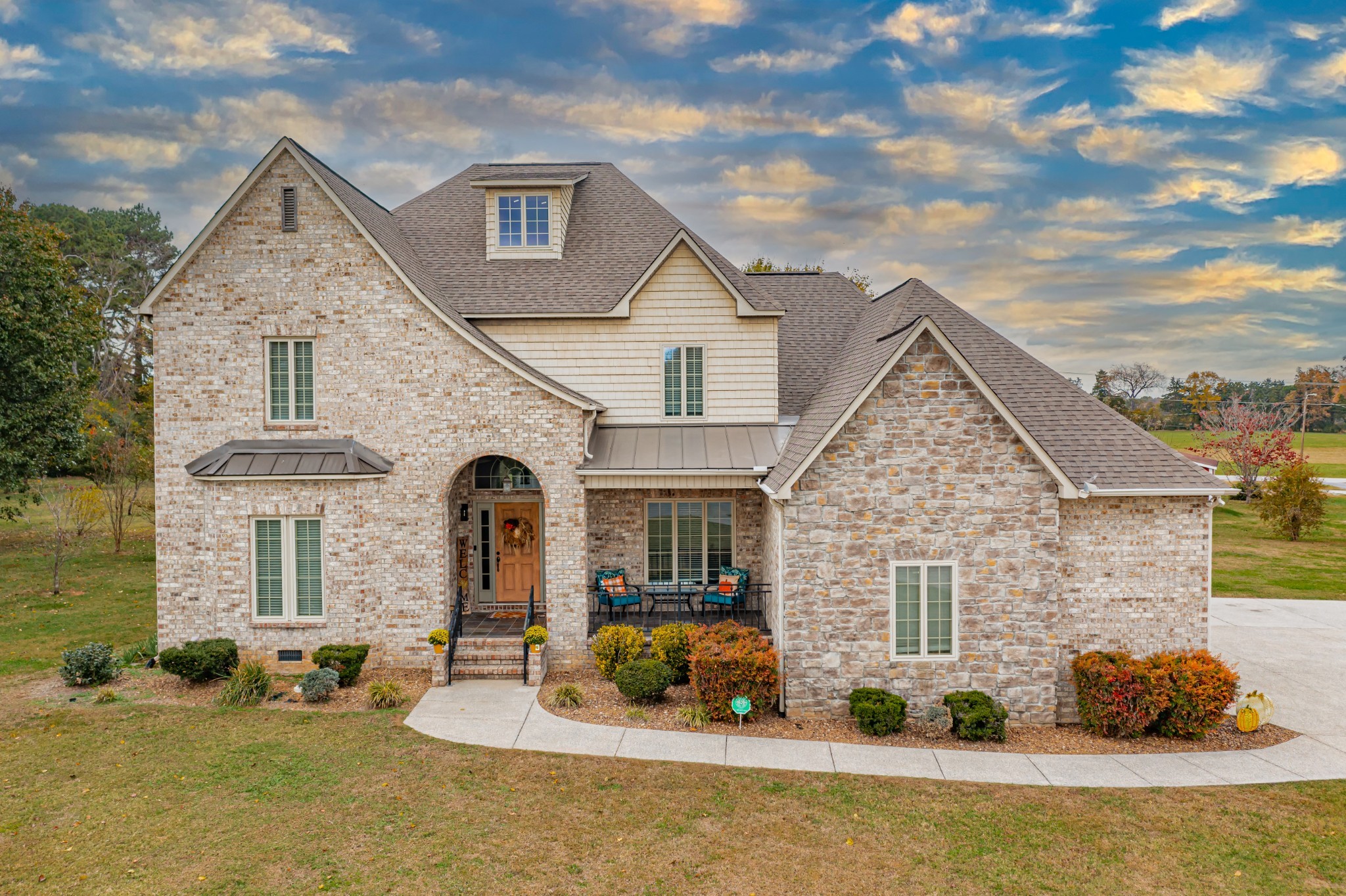 a front view of a house with a yard