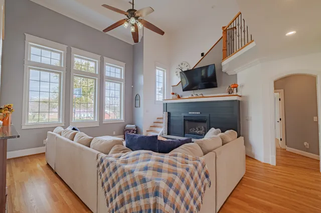 a view of living room with furniture and a fireplace