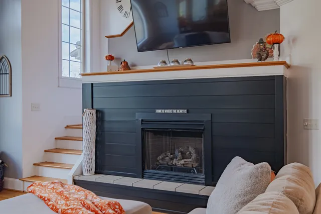 a kitchen with granite countertop stainless steel appliances a sink dishwasher a refrigerator a stove top oven and cabinets