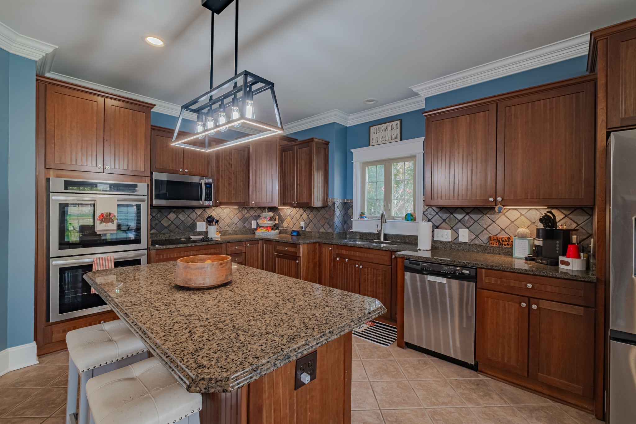 356 Ridgecrest Drive Winchester, TN 37398 - Photo 16 of 74 a kitchen with granite countertop stainless steel appliances a sink dishwasher a refrigerator a stove top oven and cabinets