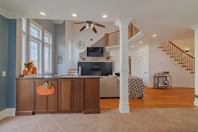 a bedroom with a bed and a large mirror