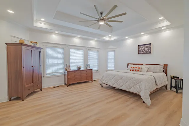 a large bathroom with a large tub shower and sink
