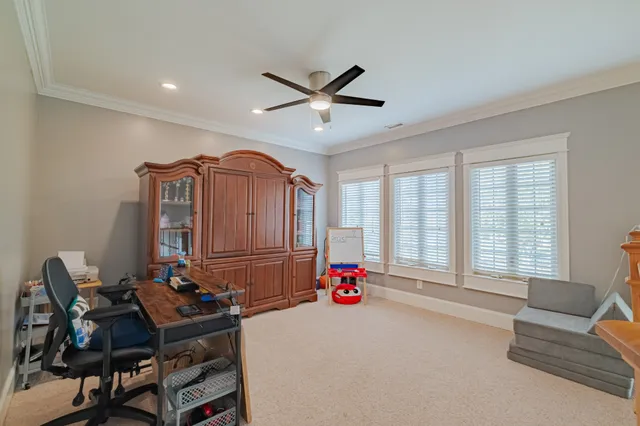 a bedroom with a bed and flat screen tv