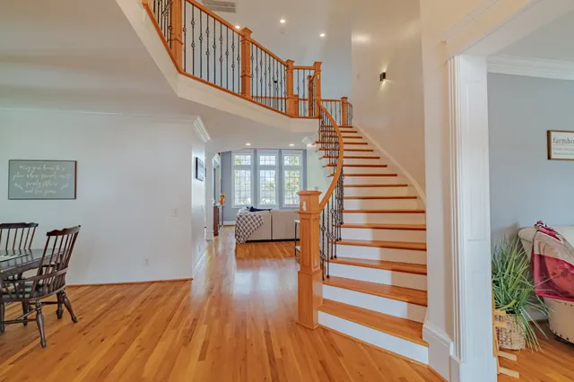 a living room with fireplace furniture and a flat screen tv