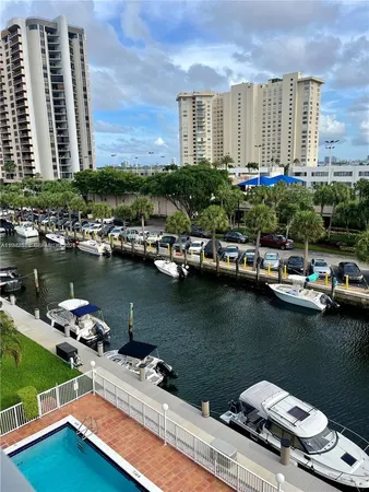 a view of a lake with tall buildings