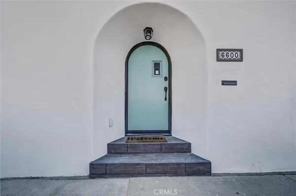 a view of a hallway with staircase