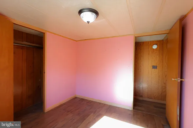 a bathroom with a granite countertop toilet and a shower