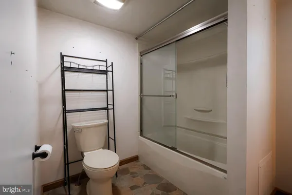 a bathroom with a sink vanity and a mirror